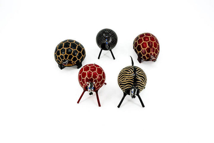 Fair trade animal bobblehead figurine hand-carved from natural gourd and polished, eco-friendly artisan decor.