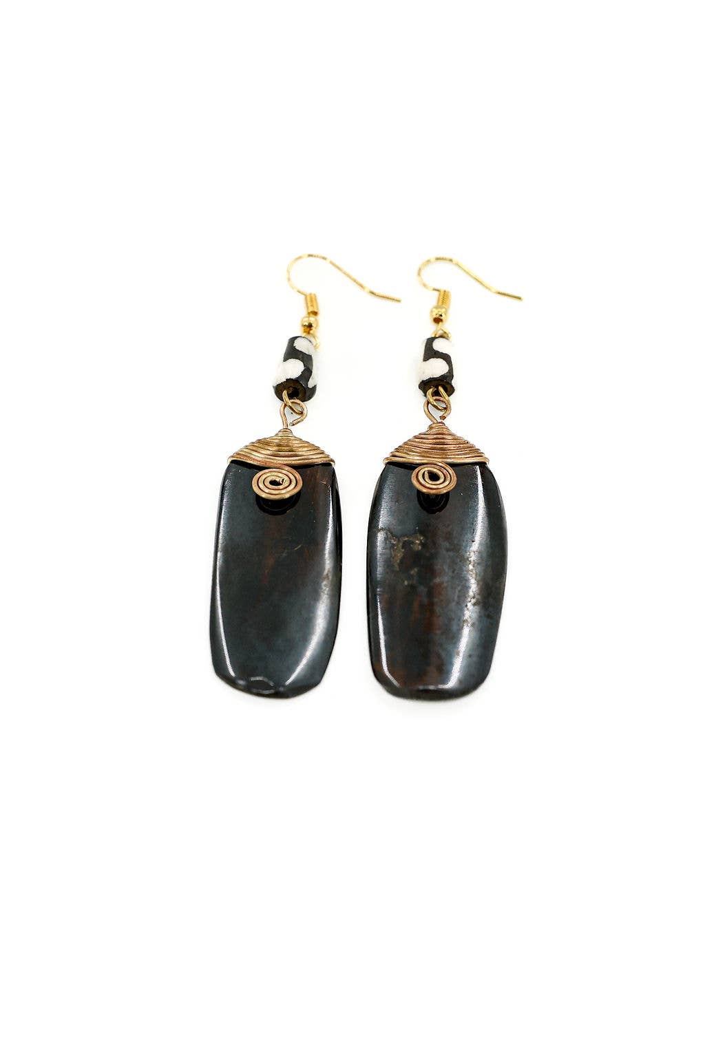 Handcrafted fair trade earrings made from up-cycled bone and brass, hand-batiked with nickel and lead-free ear wires.