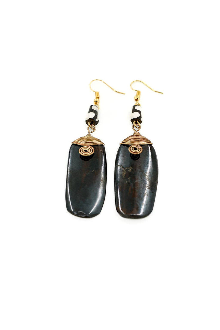 Handcrafted fair trade earrings made from up-cycled bone and brass, hand-batiked with nickel and lead-free ear wires.