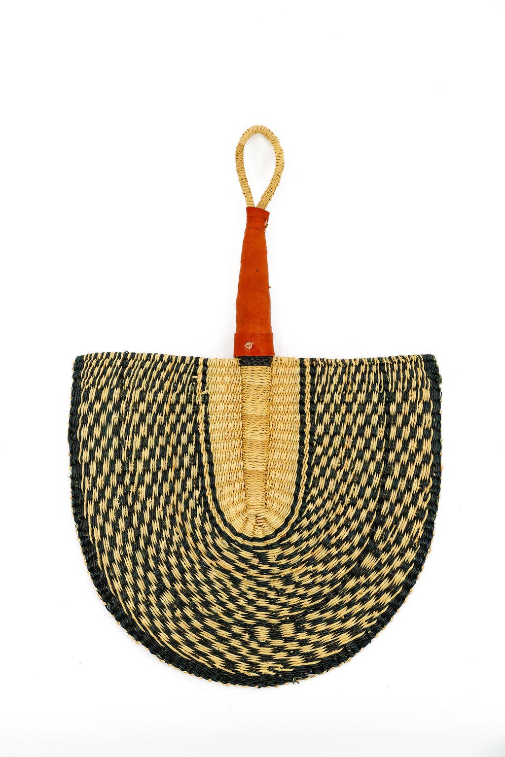 Grass fan hanging on a wall as cultural home décor.