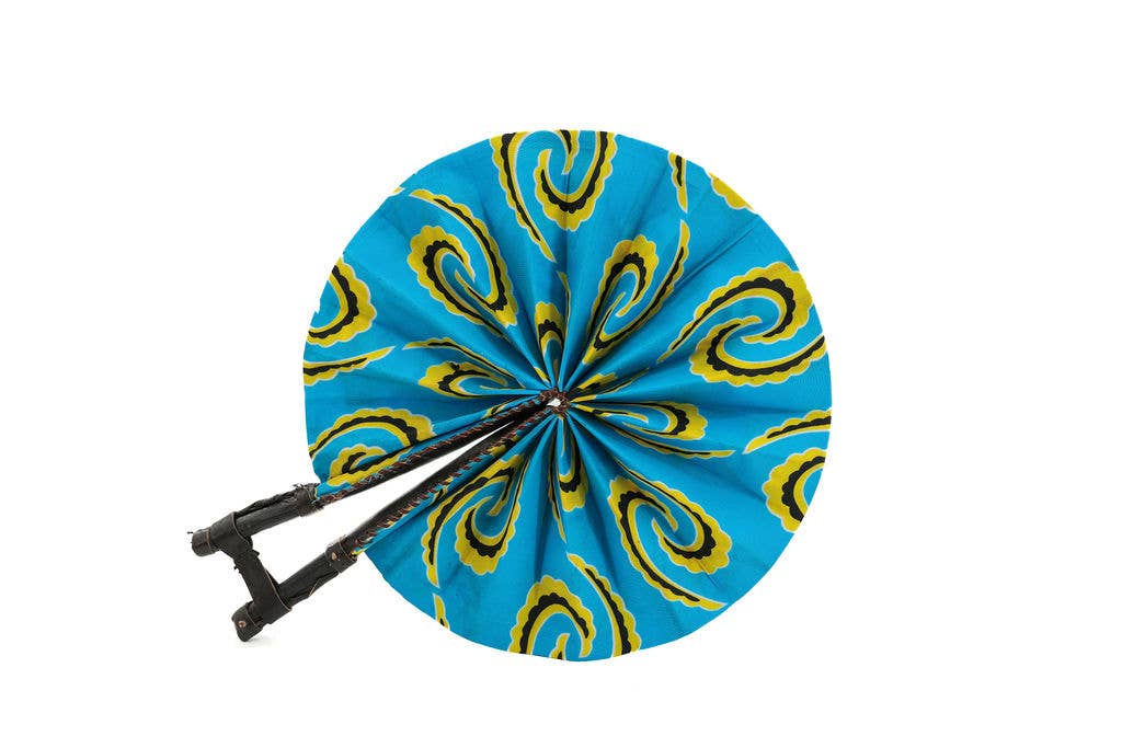 Colorful fair trade folding fan made with African print fabric.