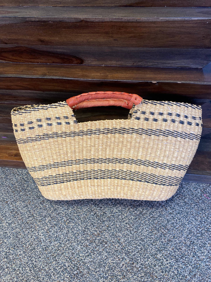 Ethically made Ghanaian handbag with natural materials and a bold, textured design for conscious fashion lovers.