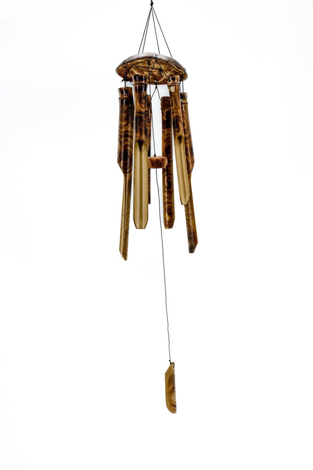Eco-friendly handmade bamboo wind chime producing soothing sounds on a porch, that's also fair trade crafted.