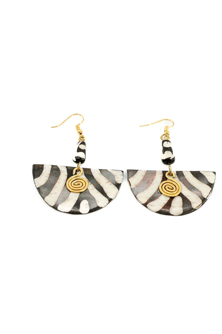 Eco-friendly fair trade earrings with hand-carved up-cycled bone and brass, featuring nickel and lead-free ear wires.