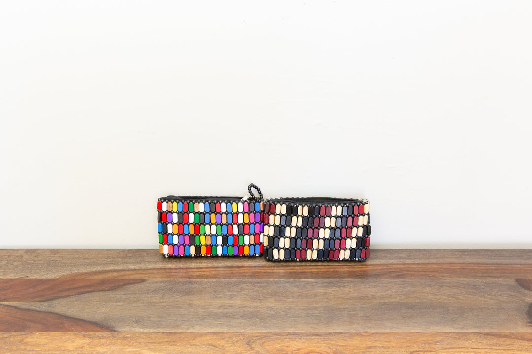 Colorful wooden clutch bags that are handmade by African artisans.
