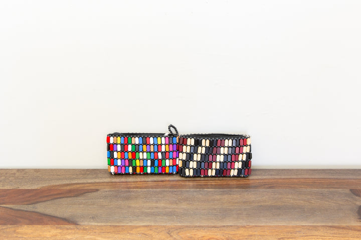 Colorful wooden clutch bags that are handmade by African artisans.