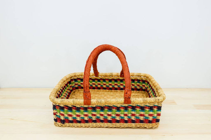 Hand-dyed fair trade square basket, perfect for berry picking or mushroom gathering, with leather handles.