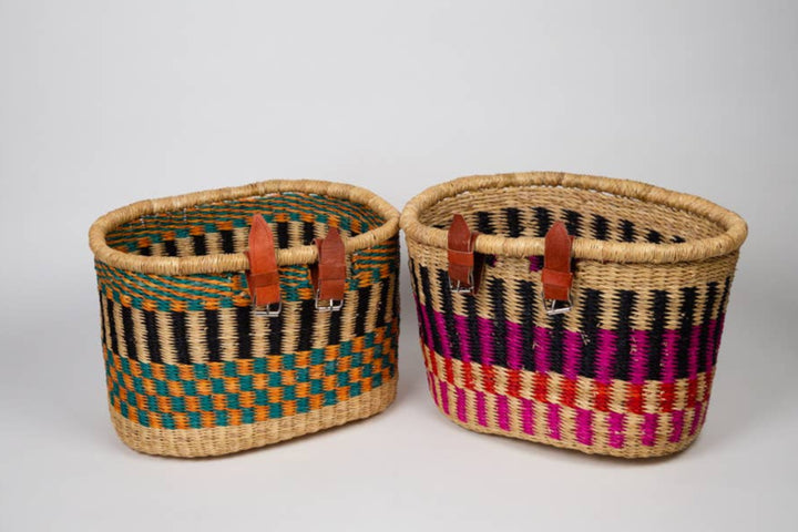 Ethically made fair trade bike basket with hand-dyed elephant grass and leather straps for handlebar use.