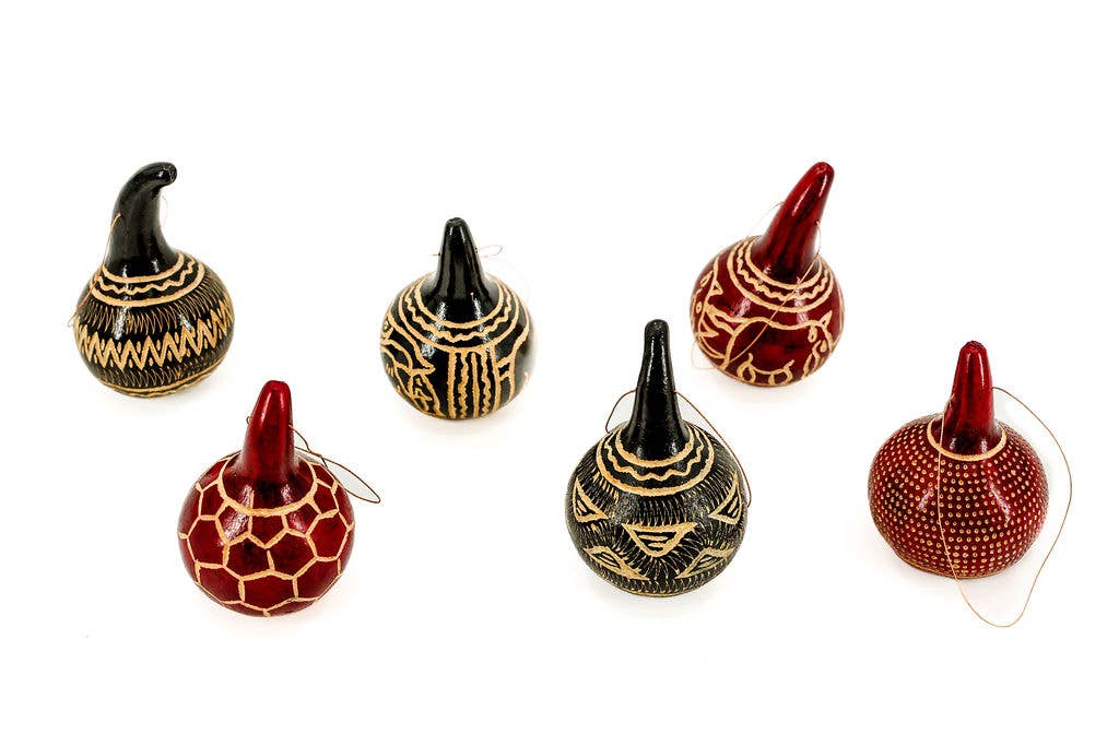 Handcrafted fair trade Christmas gourd ornament made from natural dried gourd, perfect for eco-friendly holiday décor or tabletop display.