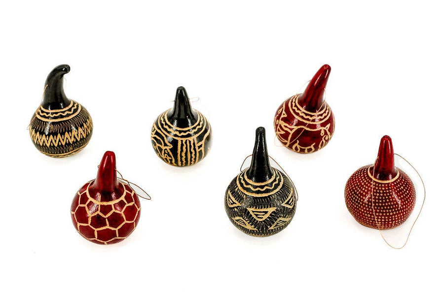 Handcrafted fair trade Christmas gourd ornament made from natural dried gourd, perfect for eco-friendly holiday décor or tabletop display.