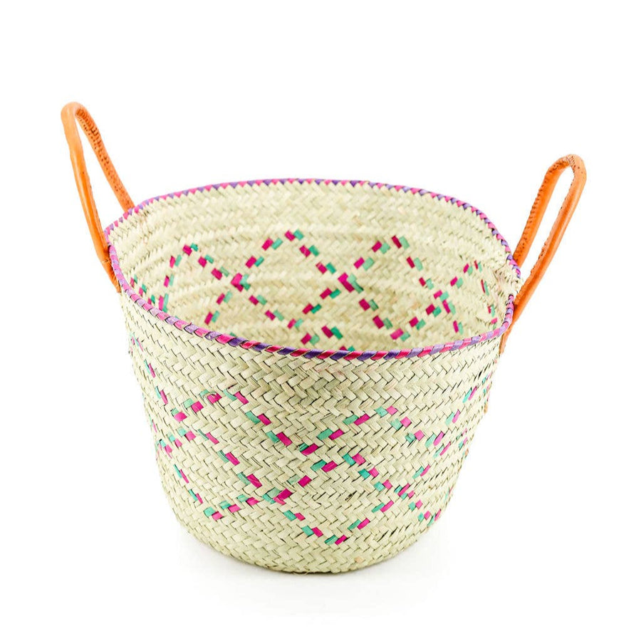 Handwoven palm tote basket with leather handles, ideal for laundry or farmers market shopping.