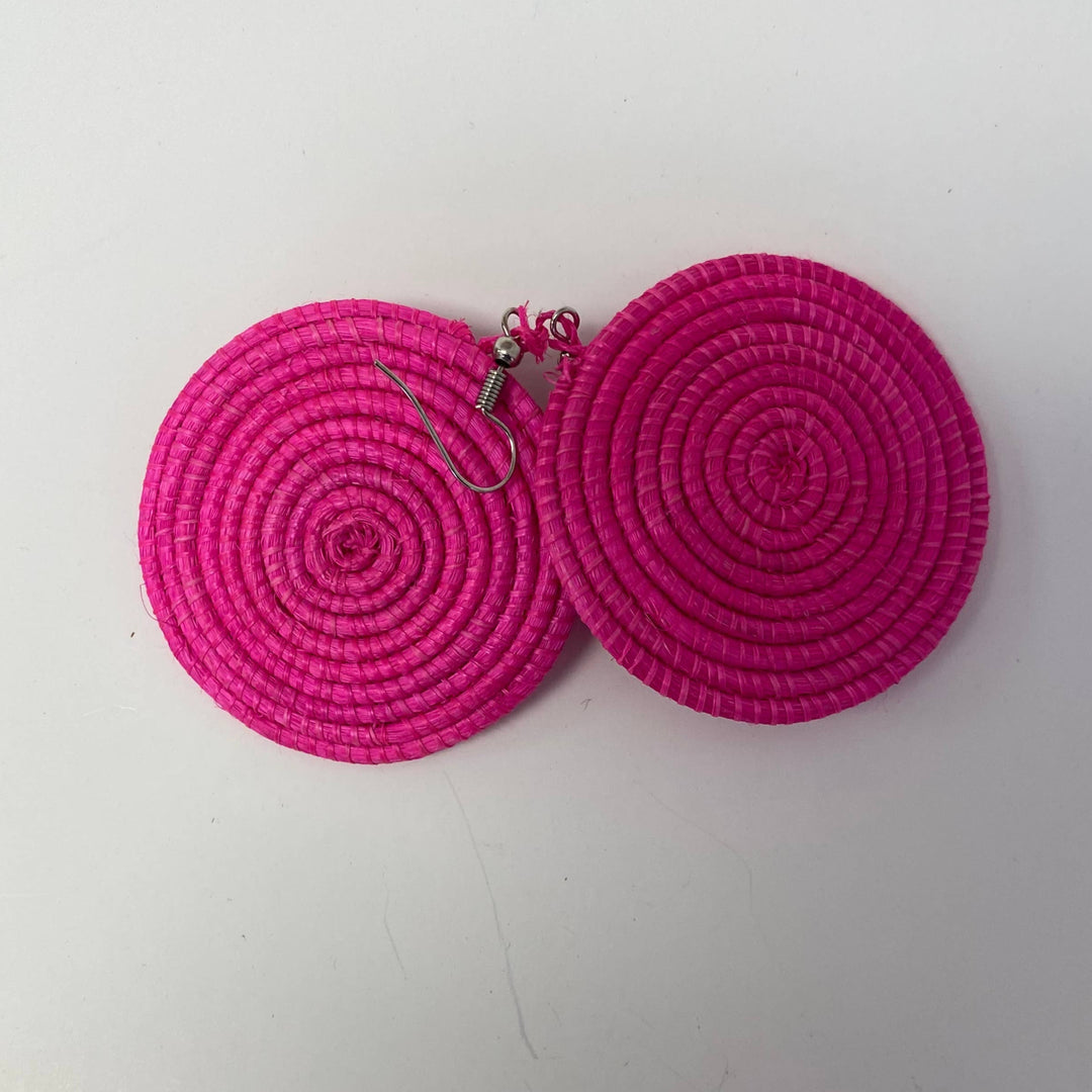 Handcrafted pink raffia earrings set with nickel-free ear wires.
