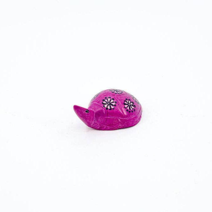 Hot pink fair trade turtle sculpture made from natural soapstone.

