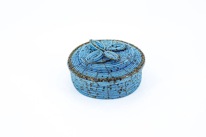 Glass bead jewelry box with floral design on lid.