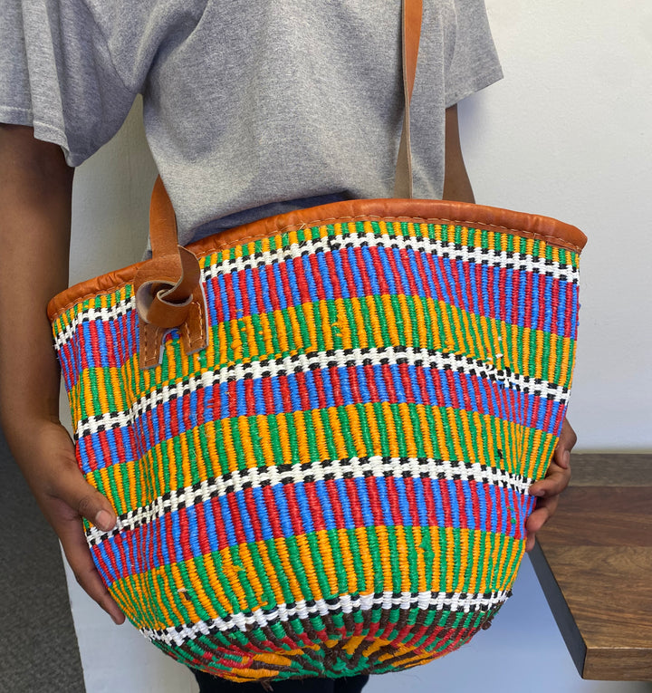 Fair Trade open weave sisal tote bag with recycled plastic accents, versatile for everyday use.