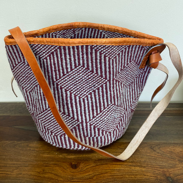 Eco-friendly sisal tote bag with leather trim, handcrafted in Kenya.