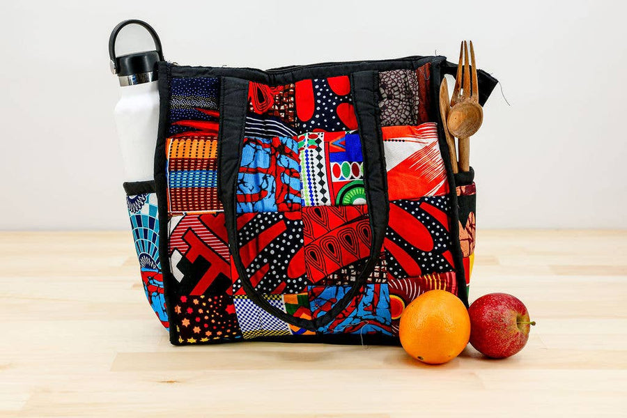 Lunchbox-style patchwork tote with interior divider and water bottle holder.