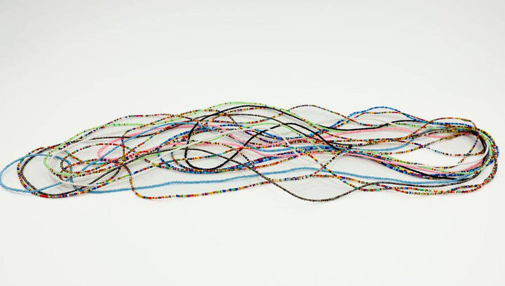 Set of 12 colorful fair trade waist beads with clasp.