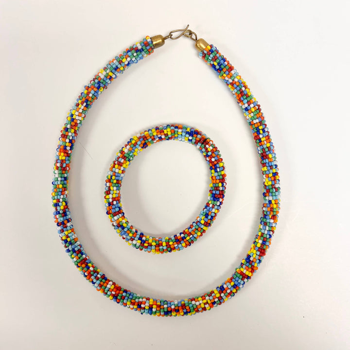 Handmade Maasai bracelet with matching necklace in traditional bead design.