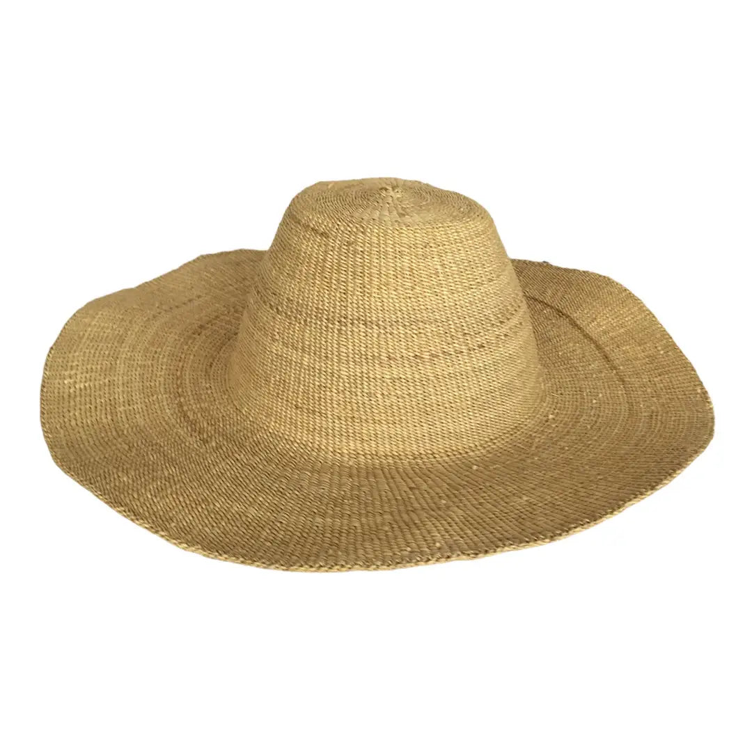 Beige, fair-trade straw hat on a white background.