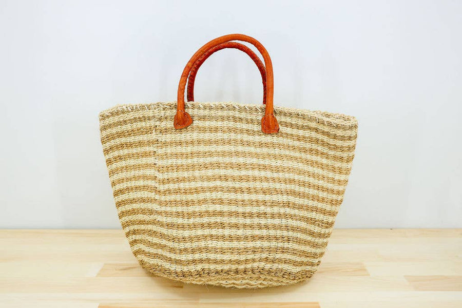 Handwoven sisal tote bag with leather handles, perfect for beach, market, or everyday use.