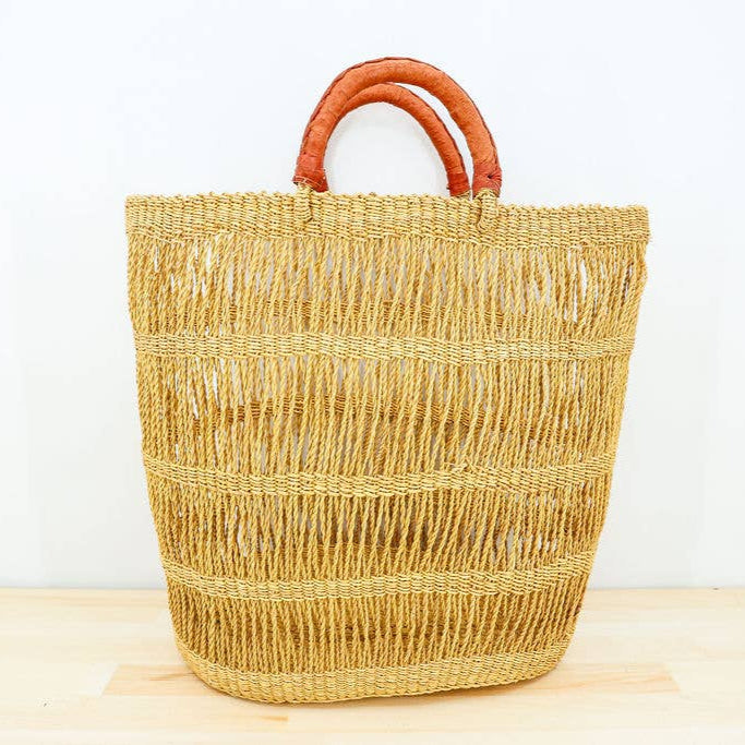 Stylish natural colored woven carryall basket with a rustic Ghanaian design.
