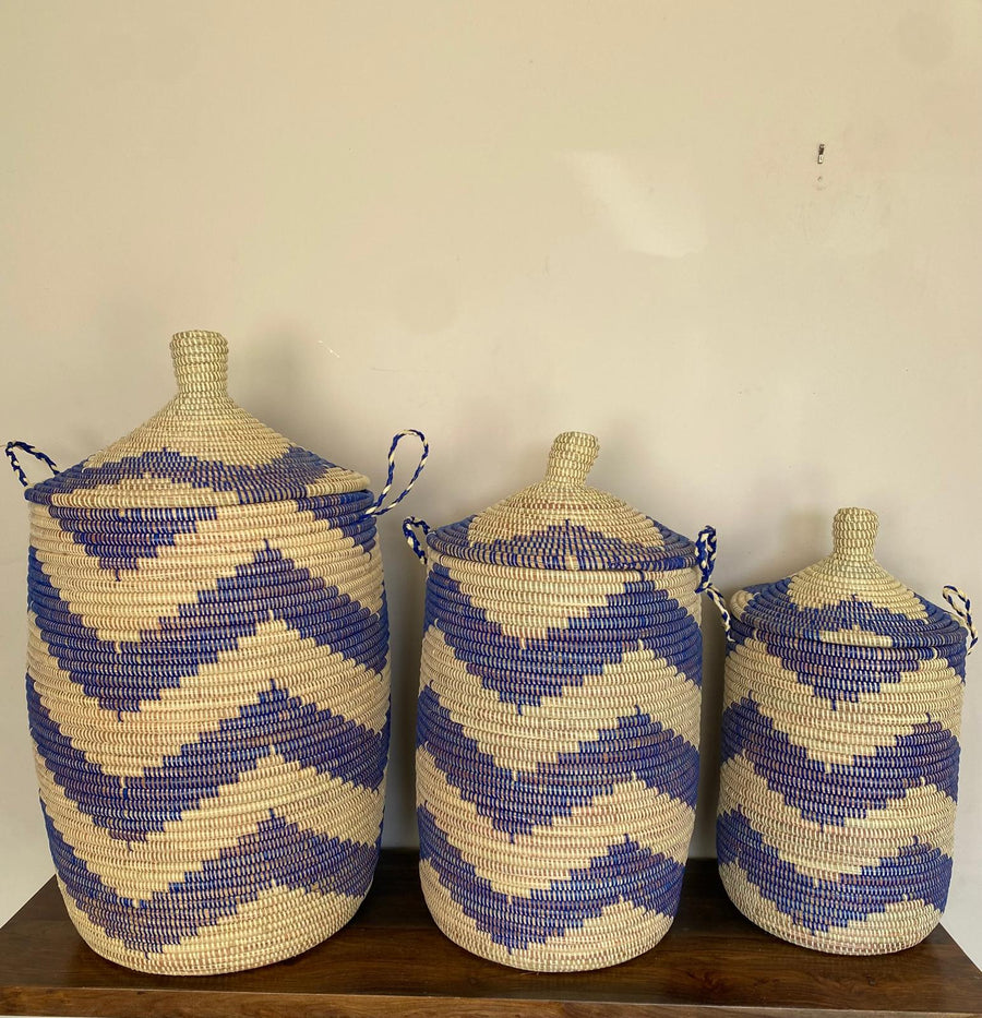 Handwoven nesting trio hampers in matching blue and beige colors to brighten the house and used for storage. Made in Senegal.