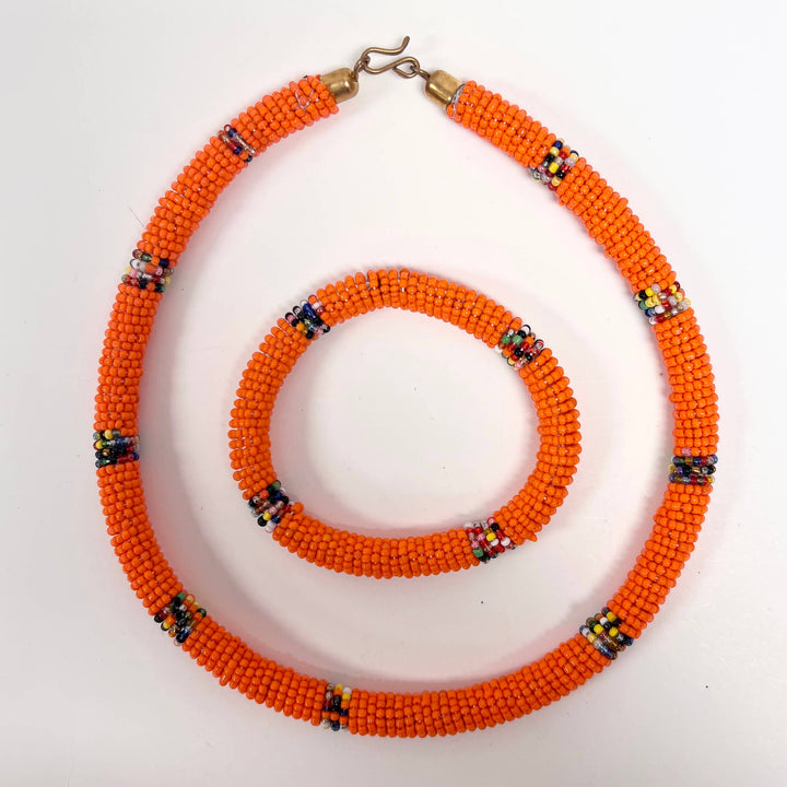 Fair trade Maasai necklace and bracelet set with orange glass beads.
