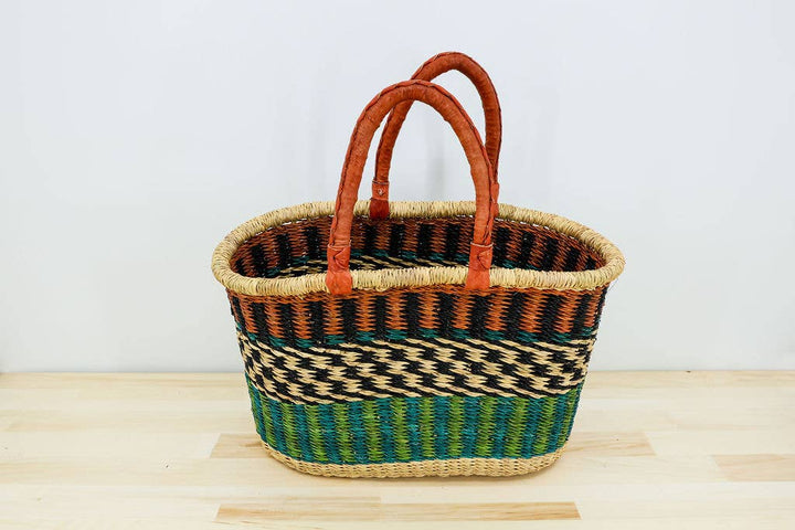 Ghanaian artisan basket with dual leather straps.