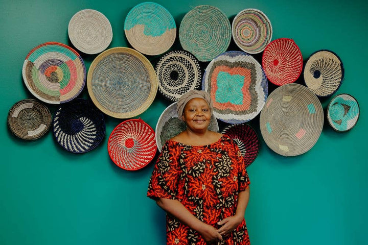 Beautifully designed wall bowl baskets in natural raffia, fair-trade handmade African decor, creating a stunning eco-friendly accent for any wall.