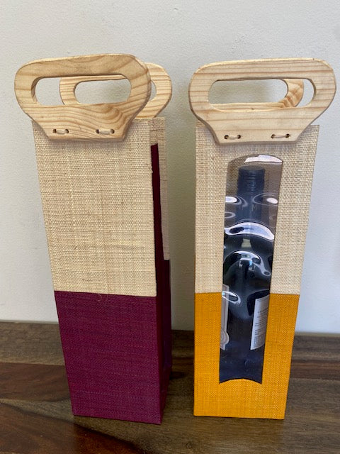 Colorful raffia wine bottle bag handmade in Africa.