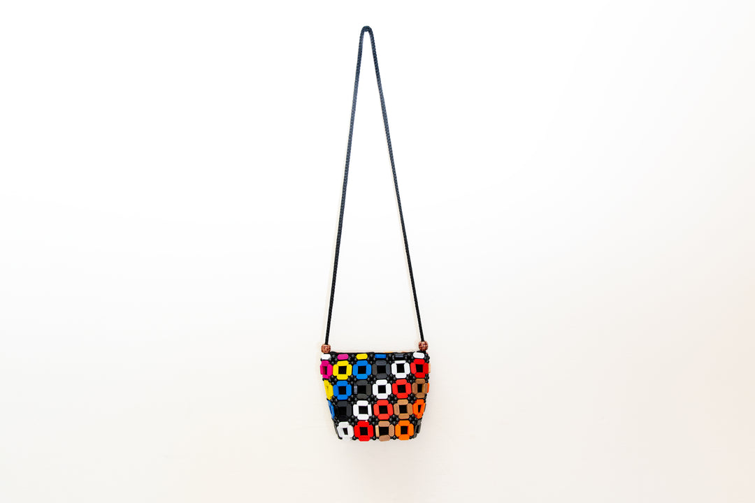 Rainbow colored crossbody purse, handmade by Fairtrade artisan in Africa.