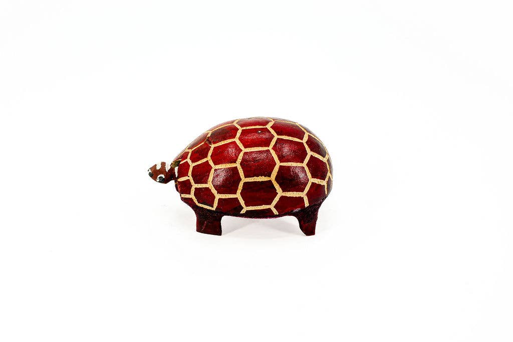 Hand-carved fair trade turtle bobblehead made from polished gourd, sustainable and whimsical artisan decor.