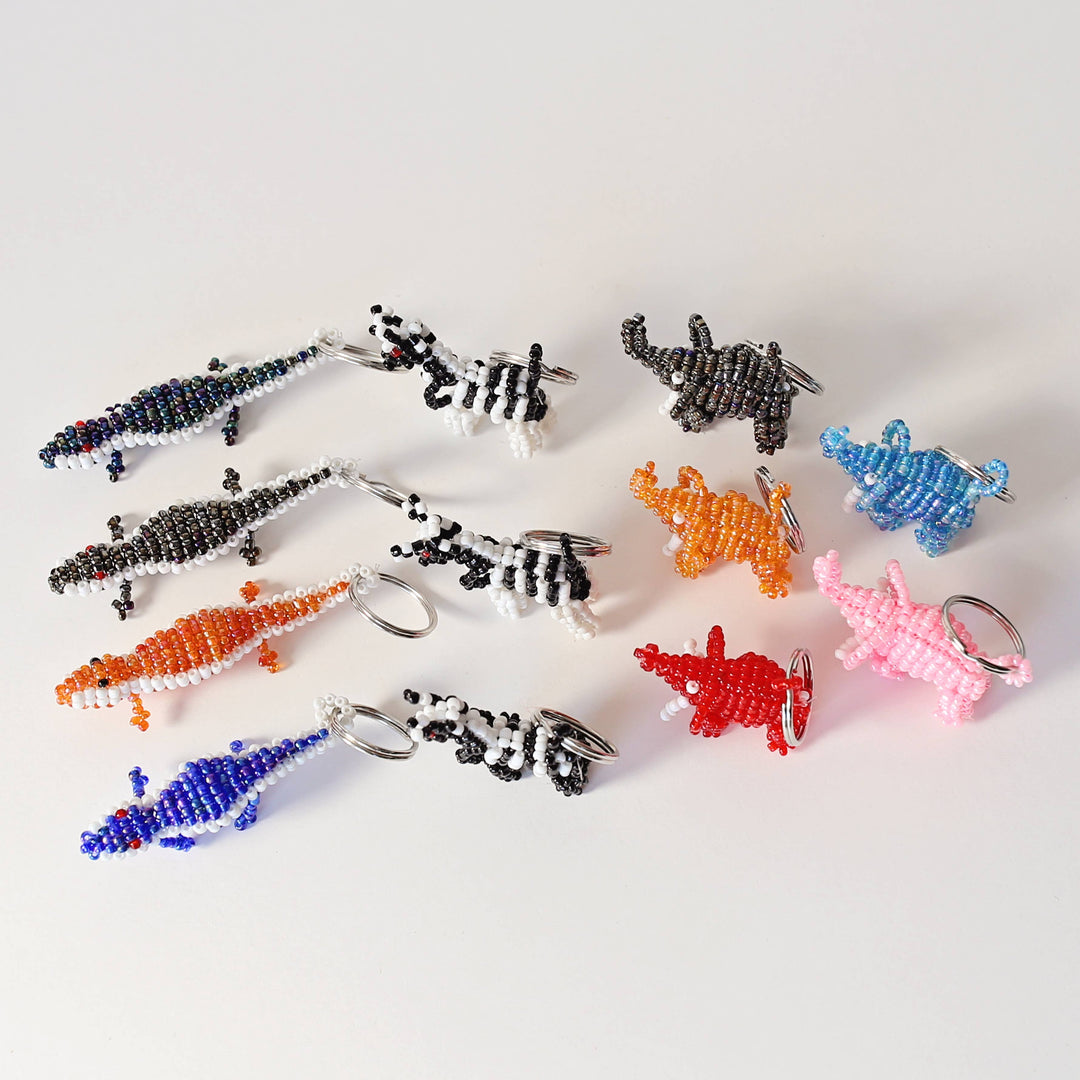 Set of 12 safari animal beaded keychains, perfect for gifts, party favors, or kids' backpacks.
