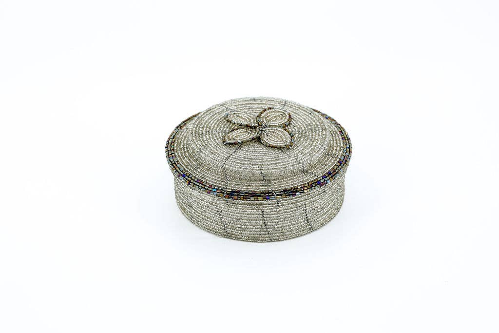 Mini beaded storage pot on a white background.