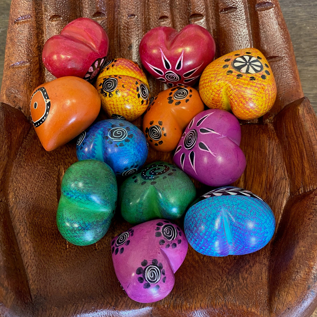 Colorful handcrafted soapstone hearts for gifts or decor.
