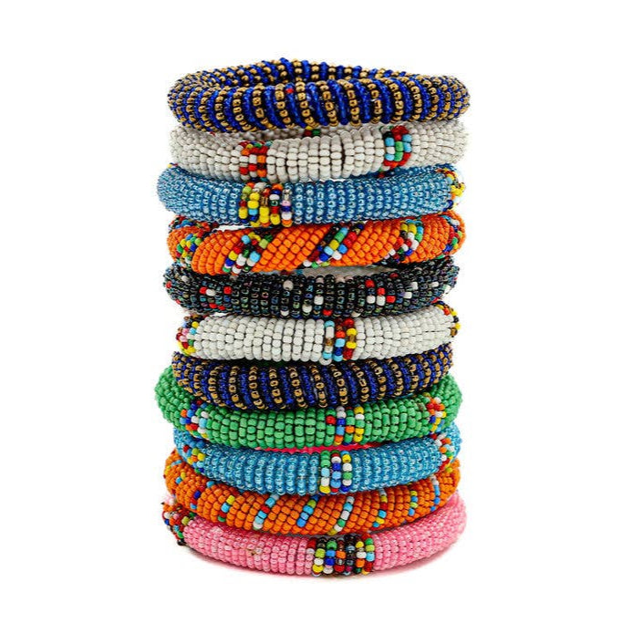 Colorful stackable bracelets handcrafted by Maasai women, fair trade beaded jewelry from Kenya.