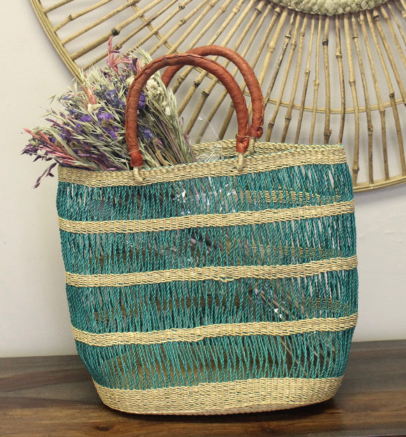 Ghanaian basket bag with two leather straps, ideal for beach or market.
