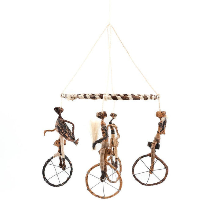 Kenyan unicycle-themed mobile with natural materials.