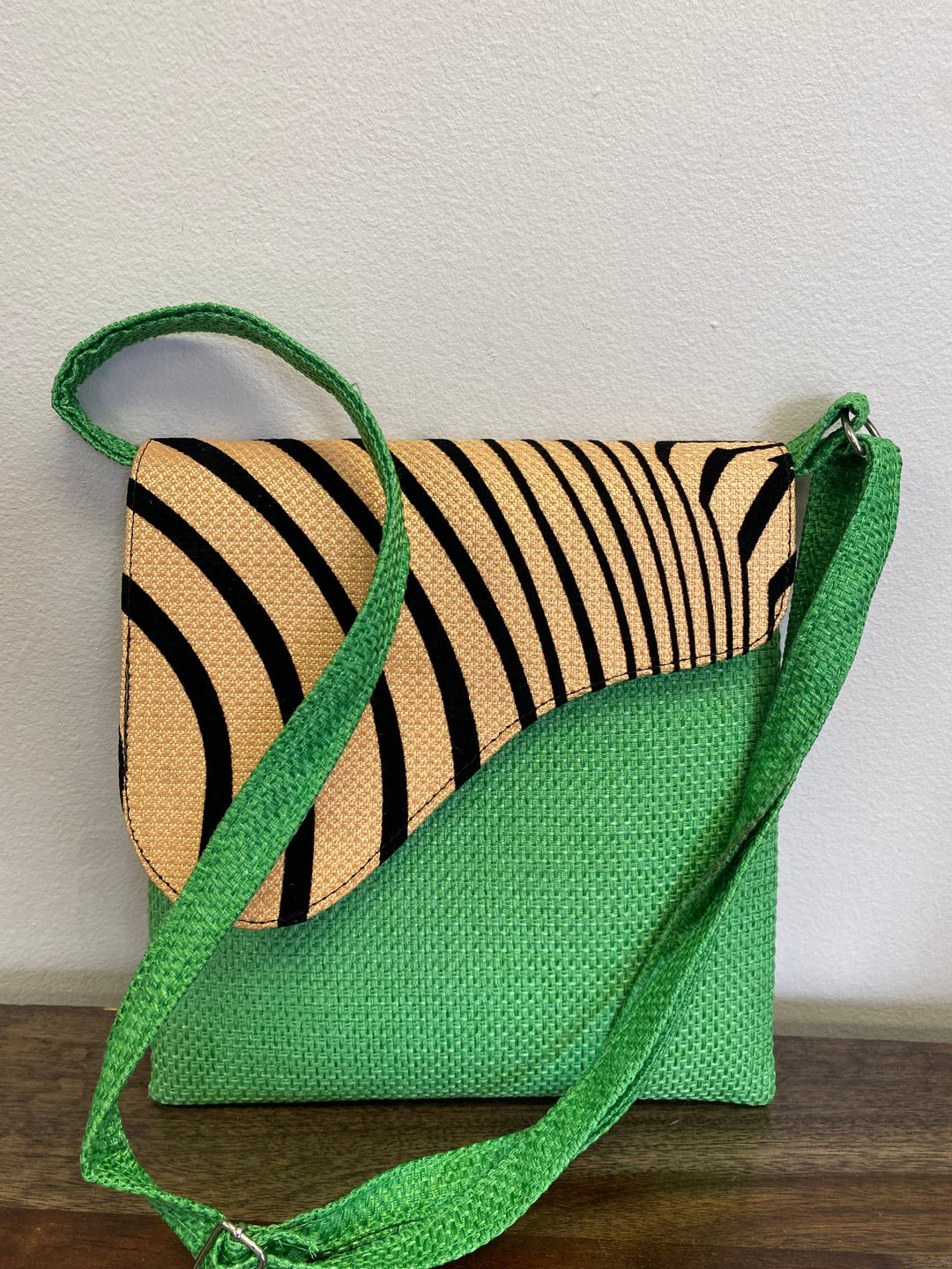Handmade fair trade crossbody bag with colorful African fabric.