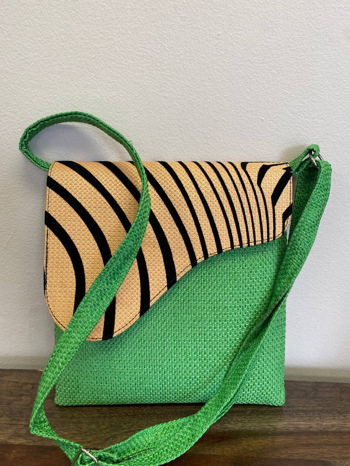 Handmade fair trade crossbody bag with colorful African fabric.