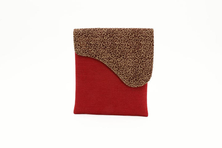Fair trade bag crafted from remnant upholstery and traditional prints.