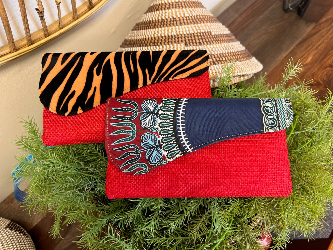 Ethically crafted African clutch bag using repurposed upholstery and traditional wax print designs.