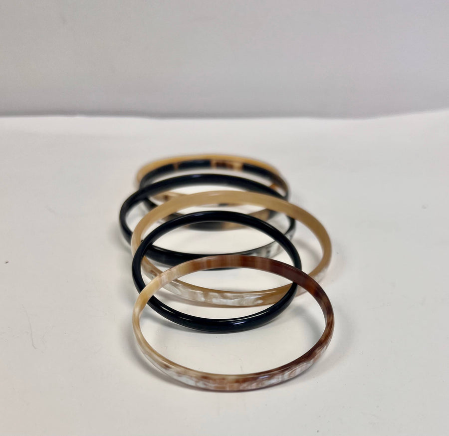 Set of six fair trade bone bangle bracelets, handcrafted from up-cycled bone with assorted colors and patterns.