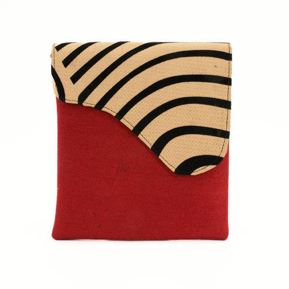 Sustainable crossbody purse with adjustable strap and bold colors.