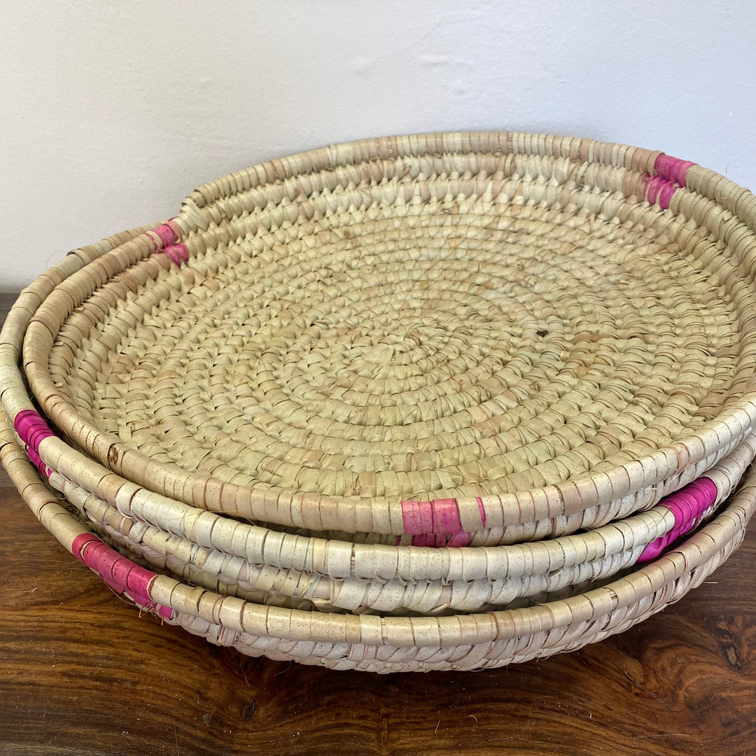 Natural palm leaf serving tray handmade by African artisans.