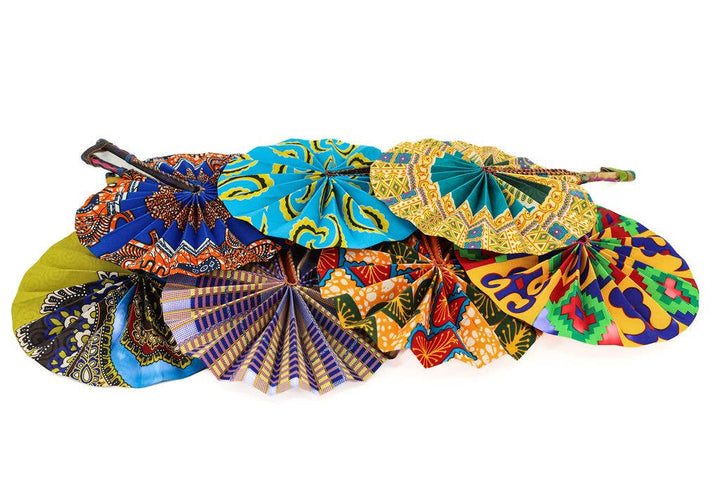 Colorful, compact African fabric fans ready for travel.