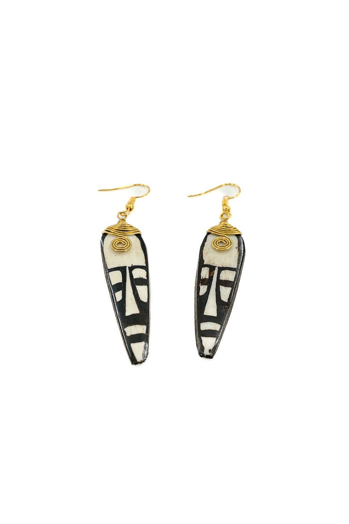 Sustainable fair trade earrings made from up-cycled bone and brass, hand-carved and hand-batiked artisan jewelry.