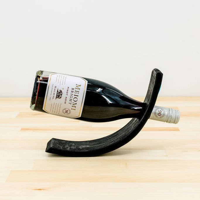 Kenyan fair trade wine holder decorated with colorful beads.