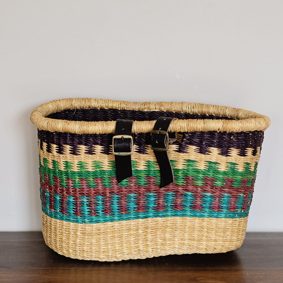African bicycle basket handwoven from elephant grass by Ghanaian artisans for functional bike storage